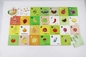 Les enfants parquettent les jeux éducatifs de casse-tête de fruit d'alphabet